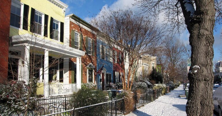 row houses on snowy street GettyImages 1086422526 1200w 628h