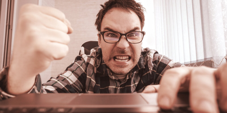 angry man shaking fist at laptop gID 4.jpg@png