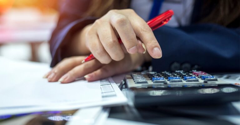 person working with calculators and papers GettyImages 951640954 1200w 628h