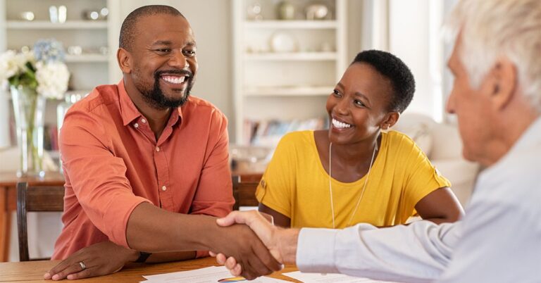 man with white hair with clients shaking hands iStock 1152603248 1200w 628h